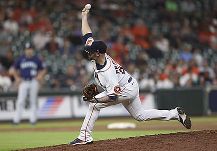 Jul 28, 2022; Houston, Texas, USA; Houston Astros relief pitcher Ryan Pressly (55) pitches against the Seattle Mariners in the ninth inning at Minute Maid Park. Mandatory Credit: Thomas Shea-USA TODAY Sports