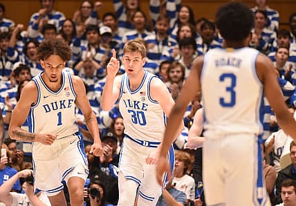 Nov 18, 2022; Durham, North Carolina, USA; Duke Blue Devils center Kyle Filipowski (30) gestures after scoring during the first half against the Delaware Blue Hens at Cameron Indoor Stadium. Mandatory Credit: Rob Kinnan-USA TODAY Sports