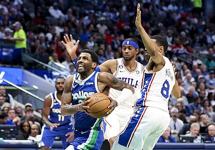Mar 2, 2023; Dallas, Texas, USA;  Dallas Mavericks guard Kyrie Irving (2) drives to the basket past Philadelphia 76ers guard De'Anthony Melton (8) during the second quarter at American Airlines Center. Mandatory Credit: Kevin Jairaj-USA TODAY Sports