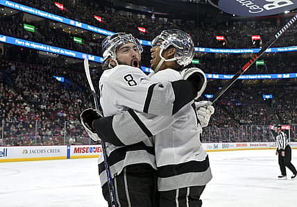 Dec 7, 2023; Montreal, Quebec, CAN; Los Angeles Kings defenseman Drew Doughty (8) celebrates with teammate forward Quinton Byfield (55) after scoring a goal against the Montreal Canadiens during the first period at the Bell Centre. Mandatory Credit: Eric Bolte-USA TODAY Sports