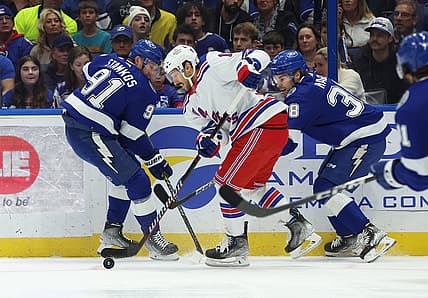Dec 30, 2023; Tampa, Florida, USA;New York Rangers center Vincent Trocheck (16) skate with the puck as Tampa Bay Lightning center Steven Stamkos (91) and Tampa Bay Lightning left wing Brandon Hagel (38) defend during the first period at Amalie Arena. Mandatory Credit: Kim Klement Neitzel-USA TODAY Sports