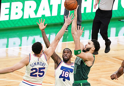 Apr 6, 2021; Boston, Massachusetts, USA; Boston Celtics forward Jayson Tatum (0) shoots against Philadelphia 76ers guard Shake Milton (18) and guard Ben Simmons (25) in the second quarter at TD Garden. Mandatory Credit: David Butler II-USA TODAY Sports