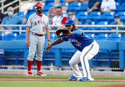 Apr 9, 2021; Dunedin, Florida, CAN; Toronto Blue Jays first baseman Vladimir Guerrero Jr. (27) catches a ball for an out at first base in a game against the Los Angeles Angels at TD Ballpark. Mandatory Credit: Nathan Ray Seebeck-USA TODAY Sports