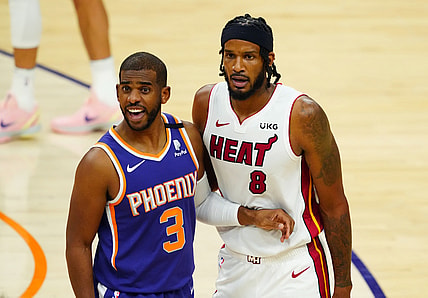 Apr 13, 2021; Phoenix, Arizona, USA; Phoenix Suns guard Chris Paul (3) against Miami Heat forward Trevor Ariza (8) in the first half at Phoenix Suns Arena. Mandatory Credit: Mark J. Rebilas-USA TODAY Sports