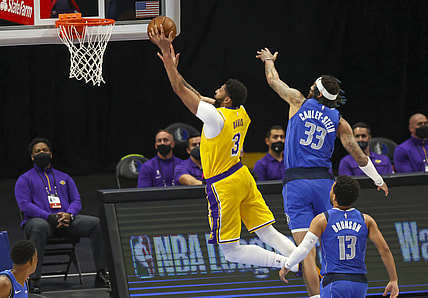Apr 22, 2021; Dallas, Texas, USA;  Los Angeles Lakers forward Anthony Davis (3) shoots past Dallas Mavericks center Willie Cauley-Stein (33) during the first quarter at American Airlines Center. Mandatory Credit: Kevin Jairaj-USA TODAY Sports
