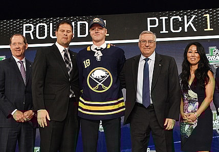 Jun 22, 2018; Dallas, TX, USA; Rasmus Dahlin poses for a photo with team executives after being selected as the number one overall pick to the Buffalo Sabres in the first round of the 2018 NHL Draft at American Airlines Center. Mandatory Credit: Jerome Miron-USA TODAY Sports