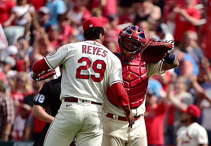 Jun 26, 2021; St. Louis, Missouri, USA;  St. Louis Cardinals catcher Yadier Molina (4) celebrates with relief pitcher Alex Reyes (29) after the Cardinals defeated the Pittsburgh Pirates at Busch Stadium. Mandatory Credit: Jeff Curry-USA TODAY Sports