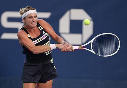 Aug 26, 2019; Flushing, NY, USA; Timea Bacsinszky of Switzerland returns a shot against Catherine McNally of the United States in a first round match on day one of the 2019 U.S. Open tennis tournament at USTA Billie Jean King National Tennis Center. Mandatory Credit: Jerry Lai-USA TODAY Sports