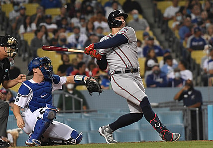 Aug 31, 2021; Los Angeles, California, USA; Atlanta Braves center fielder Joc Pederson (22) hits a solo home run against the Los Angeles Dodgers during the third inning at Dodger Stadium. Mandatory Credit: Richard Mackson-USA TODAY Sports