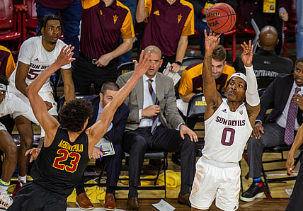 ASU sophomore guard DJ Horne (0) shoots while being guarded by USC junior Max Agbonkpolo (23) at Desert Financial Arena in Tempe, Arizona on Thursday, Feb. 3, 2022.

Asu At Arizona 2022