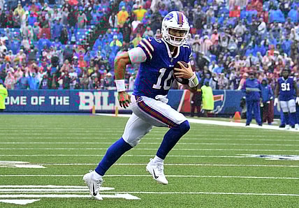 Oct 3, 2021; Orchard Park, New York, USA; Buffalo Bills quarterback Mitchell Trubisky (10) runs for a touchdown in the fourth quarter against the Houston Texans at Highmark Stadium. Mandatory Credit: Mark Konezny-USA TODAY Sports
