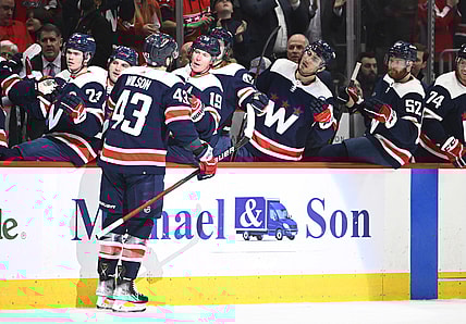 Mar 22, 2022; Washington, District of Columbia, USA; Washington Capitals right wing Tom Wilson (43) is congratulated by teammates after scoring a goal against the St. Louis Blues during the first period at Capital One Arena. Mandatory Credit: Brad Mills-USA TODAY Sports