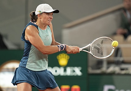 May 23, 2022; Paris, France; Iga Swiatek (POL) returns a shot during her match against Lesia Tsurenko (UKR) on day two of the French Open at Stade Roland-Garros.   Mandatory Credit: Susan Mullane-USA TODAY Sports