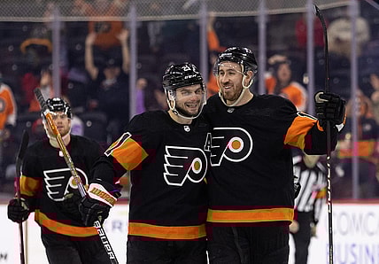 Jan 17, 2023; Philadelphia, Pennsylvania, USA; Philadelphia Flyers center Kevin Hayes (13) celebrates with center Scott Laughton (21) after scoring a goal for a hat trick against the Anaheim Ducks during the third period at Wells Fargo Center. Mandatory Credit: Bill Streicher-USA TODAY Sports
