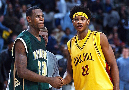 After 19 seasons, Carmelo Anthony retired from the NBA on Monday. Pictured here as a senior at Oak Hill with high school junior LeBron James.
