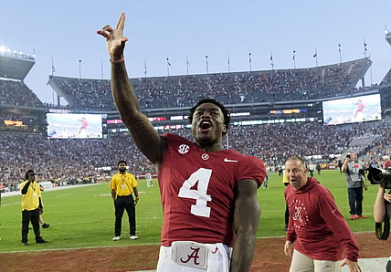 Oct 21, 2023; Tuscaloosa, Alabama, USA;  Alabama Crimson Tide quarterback Jalen Milroe (4) celebrates with fans after the Crimson Tide defeated Tennessee 34-20 at Bryant-Denny Stadium. Mandatory Credit: Gary Cosby Jr.-USA TODAY Sports
