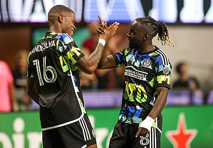 Nov 7, 2023; Atlanta, Georgia, USA; Atlanta United forward Xande Silva (16) celebrates with midfielder Tristan Muyumba (8) after scoring a goal in the first half against Columbus Crew at Mercedes-Benz Stadium. Mandatory Credit: Brett Davis -USA TODAY Sports
