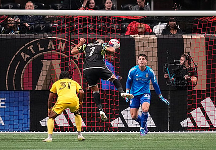 Nov 7, 2023; Atlanta, Georgia, USA; Atlanta United forward Giorgos Giakoumakis (7) scores a goal against Columbus Crew goalkeeper Diego Rossi (28) in the first half at Mercedes-Benz Stadium. Mandatory Credit: Brett Davis -USA TODAY Sports