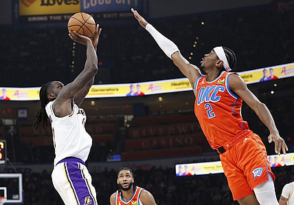 Dec 23, 2023; Oklahoma City, Oklahoma, USA; Los Angeles Lakers forward Taurean Prince (12) shoots as Oklahoma City Thunder guard Shai Gilgeous-Alexander (2) defends during the second quarter at Paycom Center. Mandatory Credit: Alonzo Adams-USA TODAY Sports