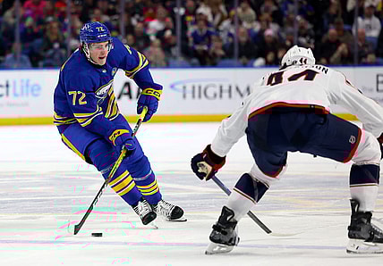 Dec 30, 2023; Buffalo, New York, USA;  Columbus Blue Jackets defenseman Erik Gudbranson (44) looks to block a pass by Buffalo Sabres right wing Tage Thompson (72) during the second period at KeyBank Center. Mandatory Credit: Timothy T. Ludwig-USA TODAY Sports