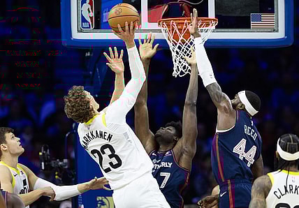 Jan 6, 2024; Philadelphia, Pennsylvania, USA; Utah Jazz forward Lauri Markkanen (23) scores past Philadelphia 76ers center Mo Bamba (7) and forward Paul Reed (44) during the first quarter at Wells Fargo Center. Mandatory Credit: Bill Streicher-USA TODAY Sports