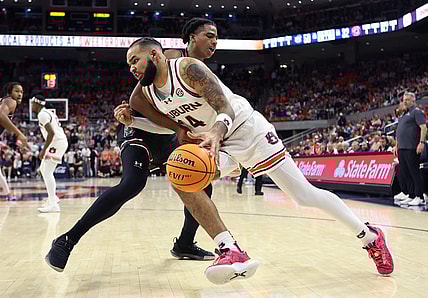 Feb 14, 2024; Auburn, Alabama, USA; South Carolina Gamecocks forward Collin Murray-Boyles (30) fouls Auburn Tigers forward Johni Broome (4) during the second half at Neville Arena. Mandatory Credit: John Reed-USA TODAY Sports