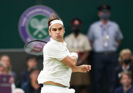Jul 5, 2021; London, United Kingdom;  Roger Federer (SUI) in action against Lorenzo Sonego (ITA) on the Centre court in the  fourth round at All England Lawn Tennis and Croquet Club. Mandatory Credit: Peter van den Berg-USA TODAY Sports