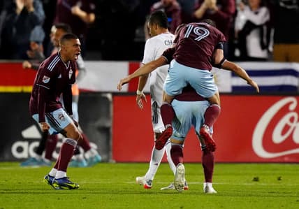 Apr 2, 2022; Commerce City, Colorado, USA; Colorado Rapids defender Lucas Esteves (66) (left), midfielder Jack Price (19) and defender Keegan Rosenberry (2) celebrate a second half goal against Real Salt Lake at Dick's Sporting Goods Park. Mandatory Credit: Ron Chenoy-USA TODAY Sports