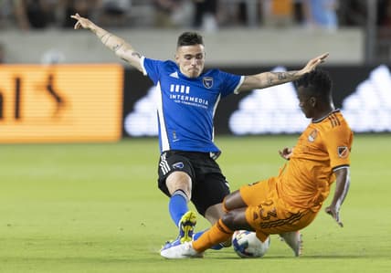 Apr 9, 2022; Houston, Texas, USA;  San Jose Earthquakes midfielder Eric Remedi (5) challenges Houston Dynamo forward Carlos Darwin Quintero (23) in the first half at BBVA Compass Stadium. Mandatory Credit: Thomas Shea-USA TODAY Sports