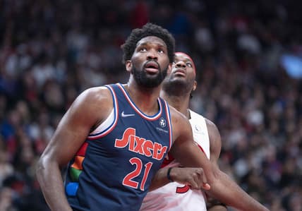 Apr 23, 2022; Toronto, Ontario, CAN;  Philadelphia 76ers center Joel Embiid (21) and Toronto Raptors forward Precious Achiuwa (5) battle for a rebound during the fourth quarter in game four of the first round for the 2022 NBA playoffs at Scotiabank Arena. Mandatory Credit: Nick Turchiaro-USA TODAY Sports