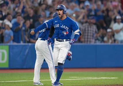 Sep 13, 2022; Toronto, Ontario, CAN; Toronto Blue Jays designated hitter George Springer (4) celebrates as he runs the bases after hitting a two run home run against the Tampa Bay Rays during the seventh inning at Rogers Centre. Mandatory Credit: Nick Turchiaro-USA TODAY Sports