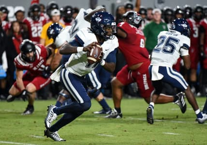Sep 24, 2022; Raleigh, North Carolina, USA;  Connecticut Huskies quarterback Zion Turner (11) looks to pass during the first half against the North Carolina State Wolfpack at Carter-Finley Stadium. Mandatory Credit: Rob Kinnan-USA TODAY Sports