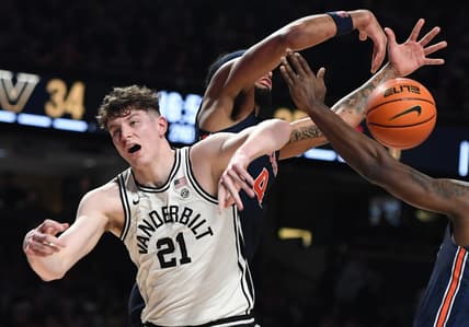 Feb 18, 2023; Nashville, Tennessee, USA; Vanderbilt Commodores forward Liam Robbins (21) is fouled on a rebound attempt during the second half against the Auburn Tigers at Memorial Gymnasium. Mandatory Credit: Christopher Hanewinckel-USA TODAY Sports