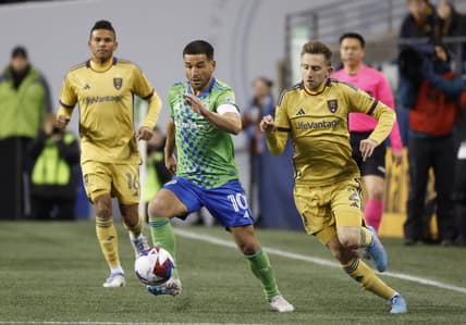 Mar 4, 2023; Seattle, Washington, USA; Seattle Sounders midfielder Nicolas Lodeiro (10) and Real Salt Lake defender Andrew Brody (2) battle for the ball during the first half at Lumen Field. Mandatory Credit: Joe Nicholson-USA TODAY Sports