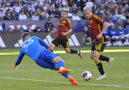Apr 1, 2023; Carson, California, USA;  Seattle Sounders forward Jordan Morris (13) scores a goal past Los Angeles Galaxy goalkeeper Jonathan Kingsmann (33) in the first half at Dignity Health Sports Park. Mandatory Credit: Jayne Kamin-Oncea-USA TODAY Sports