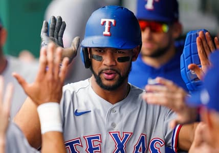 Apr 19, 2023; Kansas City, Missouri, USA; Texas Rangers center fielder Leody Taveras (3) celebrates with teammates in the dugout after scoring a run during the second inning against the Kansas City Royals at Kauffman Stadium. Mandatory Credit: Jay Biggerstaff-USA TODAY Sports