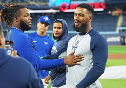 Apr 28, 2023; Toronto, Ontario, CAN; Seattle Mariners right fielder Teoscar Hernandez (right) greets Toronto Blue Jays first baseman Vladimir Guerrero Jr. (left) during batting practice prior to their game at Rogers Centre. Mandatory Credit: Nick Turchiaro-USA TODAY Sports