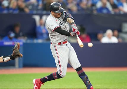 Jun 9, 2023; Toronto, Ontario, CAN; Minnesota Twins shortstop Carlos Correa (4) hits a single against the Toronto Blue Jays during the sixth inning at Rogers Centre. Mandatory Credit: Nick Turchiaro-USA TODAY Sports