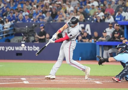 Jun 11, 2023; Toronto, Ontario, CAN; Minnesota Twins left fielder Trevor Larnach (9) hits a two-run single against the Toronto Blue Jays during the first inning at Rogers Centre. Mandatory Credit: Nick Turchiaro-USA TODAY Sports