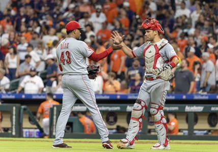 Jun 16, 2023; Houston, Texas, USA;  Cincinnati Reds relief pitcher Alexis Diaz (43) and  catcher Luke Maile (22) celebrate the win agains the Houston Astros  at Minute Maid Park. Mandatory Credit: Thomas Shea-USA TODAY Sports