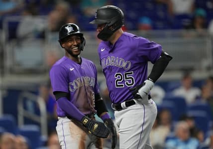 Jul 21, 2023; Miami, Florida, USA;  Colorado Rockies first baseman C.J. Cron (25) is congratulated by left fielder Jurickson Profar (29) after hitting a two-run home run in the first inning against the Miami Marlins at loanDepot Park. Mandatory Credit: Jim Rassol-USA TODAY Sports