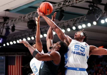 Nov 23, 2023; Paradise Island, BAHAMAS;  North Carolina Tar Heels forward Harrison Ingram (55) and North Carolina Tar Heels forward Jalen Washington (13) battle for the ball with Villanova Wildcats guard TJ Bamba (0) during the first half at Imperial Arena. Mandatory Credit: Kevin Jairaj-USA TODAY Sports