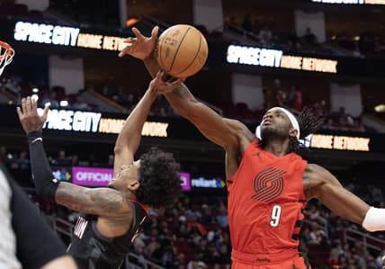 Jan 24, 2024; Houston, Texas, USA; Houston Rockets guard Jalen Green (4) is fouled by Portland Trail Blazers forward Jerami Grant (9) in the second quarter at Toyota Center. Mandatory Credit: Thomas Shea-USA TODAY Sports