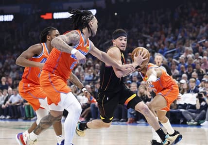 Mar 29, 2024; Oklahoma City, Oklahoma, USA; Phoenix Suns guard Devin Booker (1) drives to the basket between Oklahoma City Thunder guard Aaron Wiggins (21) and forward Jaylin Williams (6) during the first half at Paycom Center. Mandatory Credit: Alonzo Adams-USA TODAY Sports