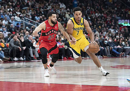 Oct 27, 2021; Toronto, Ontario, CAN; Indiana Pacers guard Malcolm Brogdon (7) controls the ball as Toronto Raptors guard Fred VanVleet (23) tries to defend during the second quarter at Scotiabank Arena. Mandatory Credit: Nick Turchiaro-USA TODAY Sports