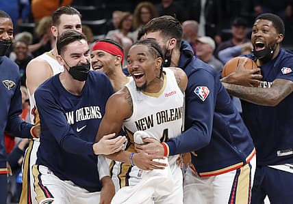 Dec 15, 2021; Oklahoma City, Oklahoma, USA; New Orleans Pelicans guard Devonte' Graham (4) celebrates with his team after hitting the game winning three point shot as time expired against the Oklahoma City Thunder during the second half at Paycom Center. New Orleans won 113-110. Mandatory Credit: Alonzo Adams-USA TODAY Sports