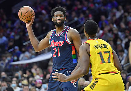 Dec 23, 2021; Philadelphia, Pennsylvania, USA;  Philadelphia 76ers center Joel Embiid (21) is defended by Atlanta Hawks forward Onyeka Okongwu (17) during the third quarter at Wells Fargo Center. Mandatory Credit: Eric Hartline-USA TODAY Sports