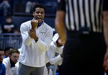 Rams coach David Cox tries to get the attention of a referee after what he thinks was a missed call in the first half.