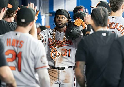 Aug 16, 2022; Toronto, Ontario, CAN; Baltimore Orioles center fielder Cedric Mullins (31) celebrates in the dugout after hitting a home run against the Toronto Blue Jays during the fifth inning at Rogers Centre. Mandatory Credit: Nick Turchiaro-USA TODAY Sports