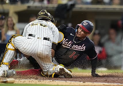 Aug 20, 2022; San Diego, California, USA;  Washington Nationals third baseman Ildemaro Vargas (14) is tagged out at home plate by San Diego Padres catcher Austin Nola (26) during the fifth inning at Petco Park. Mandatory Credit: Ray Acevedo-USA TODAY Sports